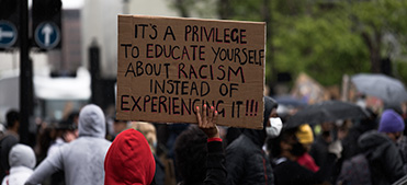 Demonstrator holding Black Lives Matter sign