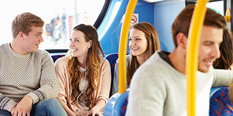 Students chatting on a bus