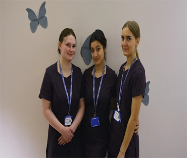 Three beauty students smiling for a photo