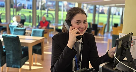 Hospitality student taking phone call