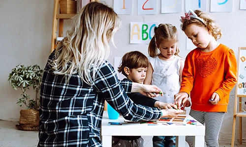 Primary school teacher with children