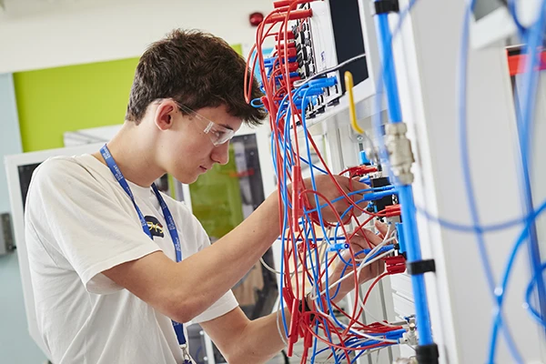 Student working on electrical cables