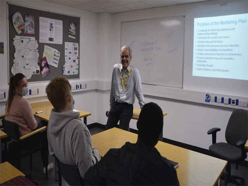 Jon Hepburn talking to a classroom of students