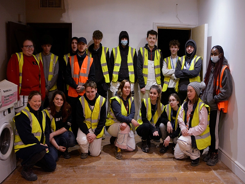 Group of students with teacher at the ark smiling for photo