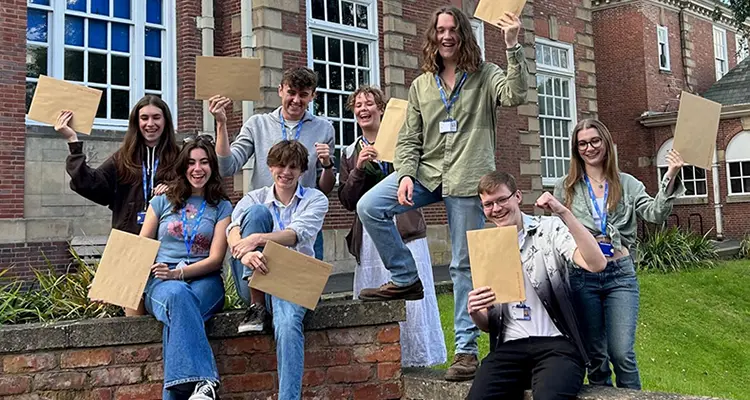 Students holding results