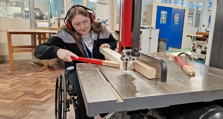 Helen Docker using machinery on Carpentry course