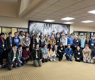 Large group of students standing together smiling