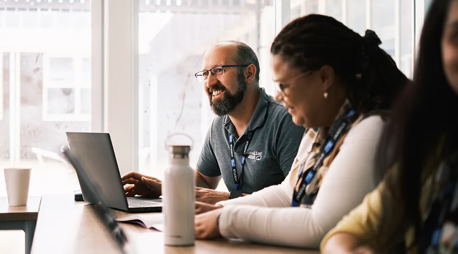 mature male and female learners in classroom 